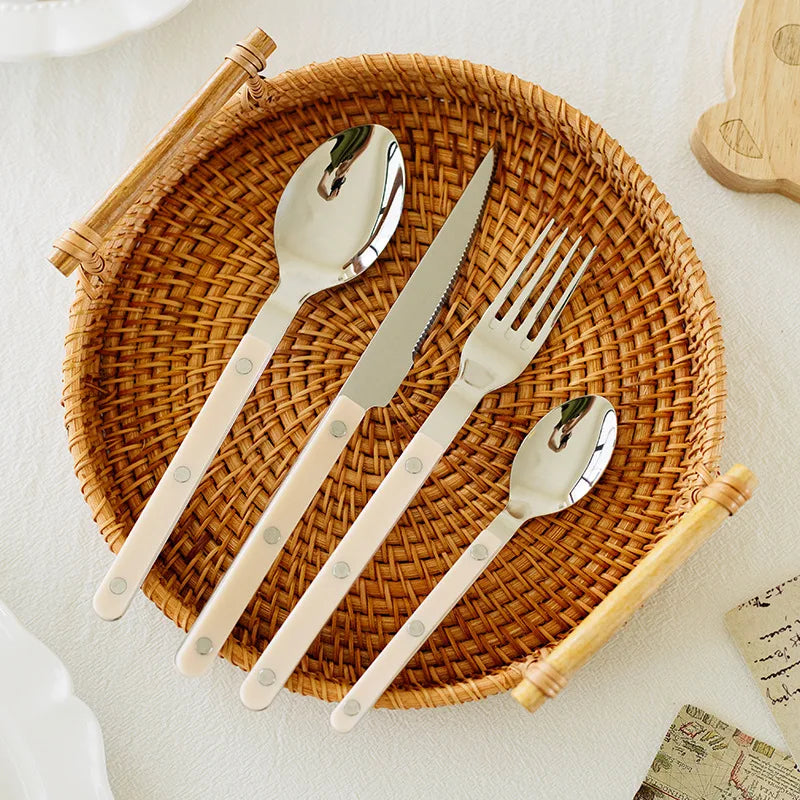 Premium 24-piece stainless steel cutlery set, featuring an elegant engraved pattern for dinnerware.