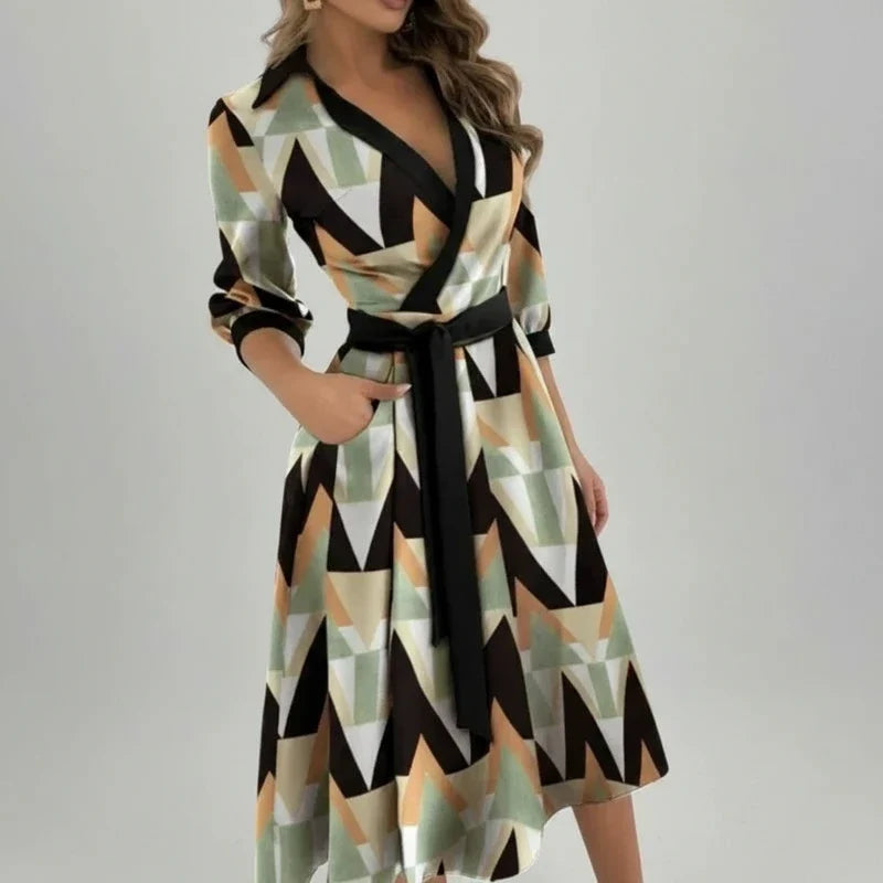 Flowy women's A-line midi dress with a belt. Elegant V-neck design for versatile spring wear.