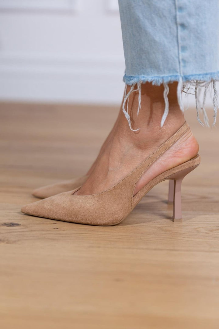 Stylish women's beige pointed-toe slingback heels, designed for orthopedic comfort and all-day wear.