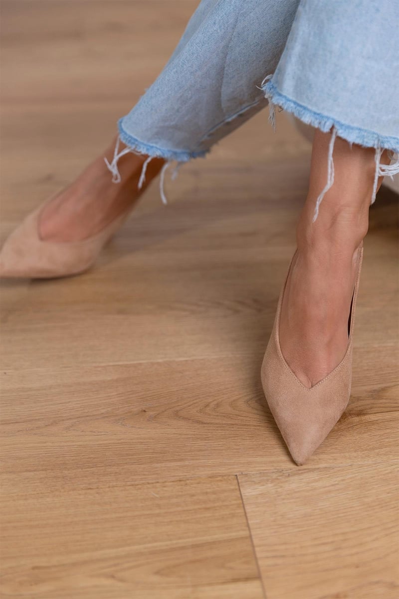 Women's beige slingback heels with pointed toe, offering orthopedic design and all-day comfort.