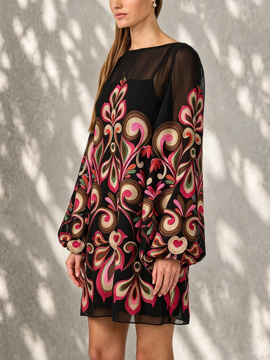 Sophisticated women's black floral mini dress, boat neck, and trendy sheer balloon sleeves.