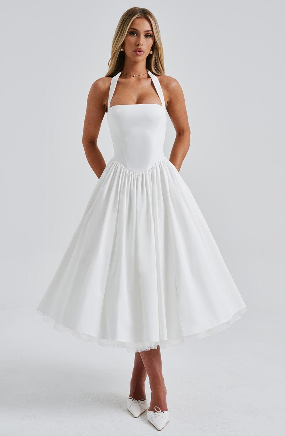 Back view of the women's halter neck midi dress, showcasing a graceful silhouette for occasions