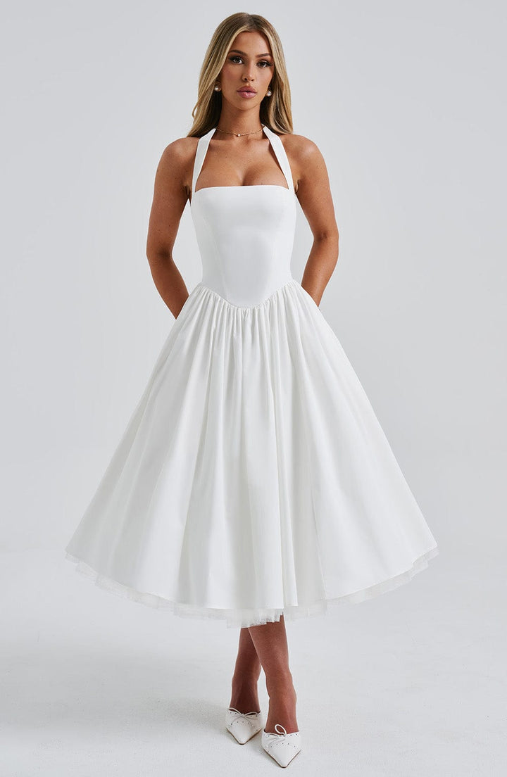 Back view of the women's halter neck midi dress, showcasing a graceful silhouette for occasions