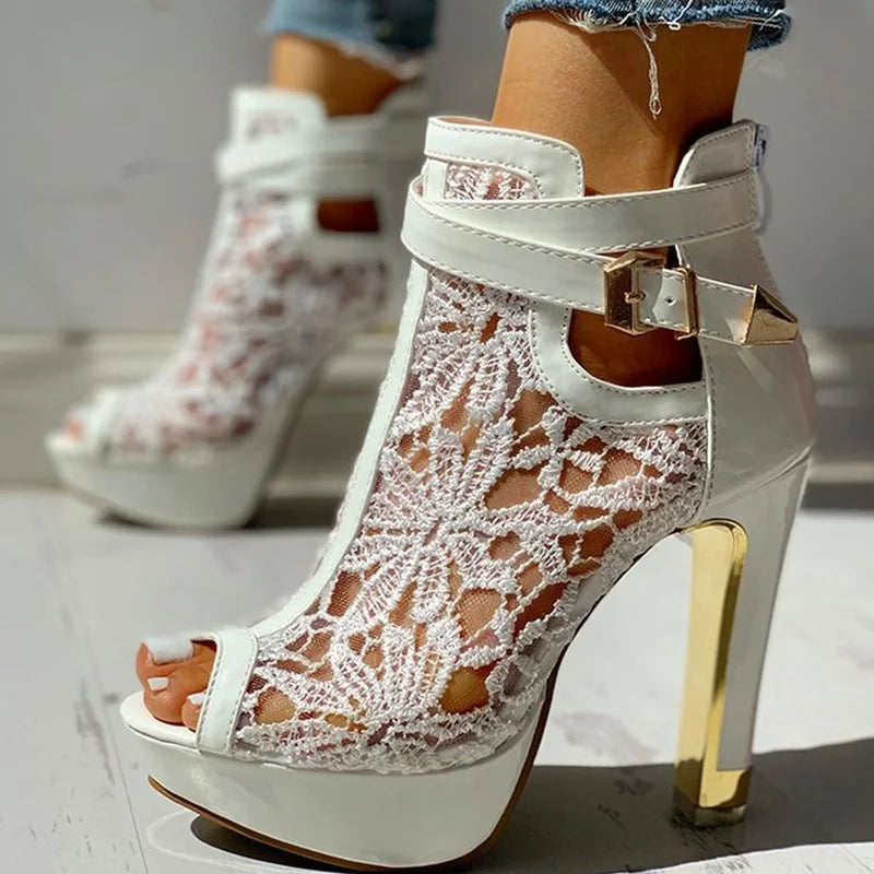 Front view of women's fashion-forward black lace platform high heels, suitable for various occasions.