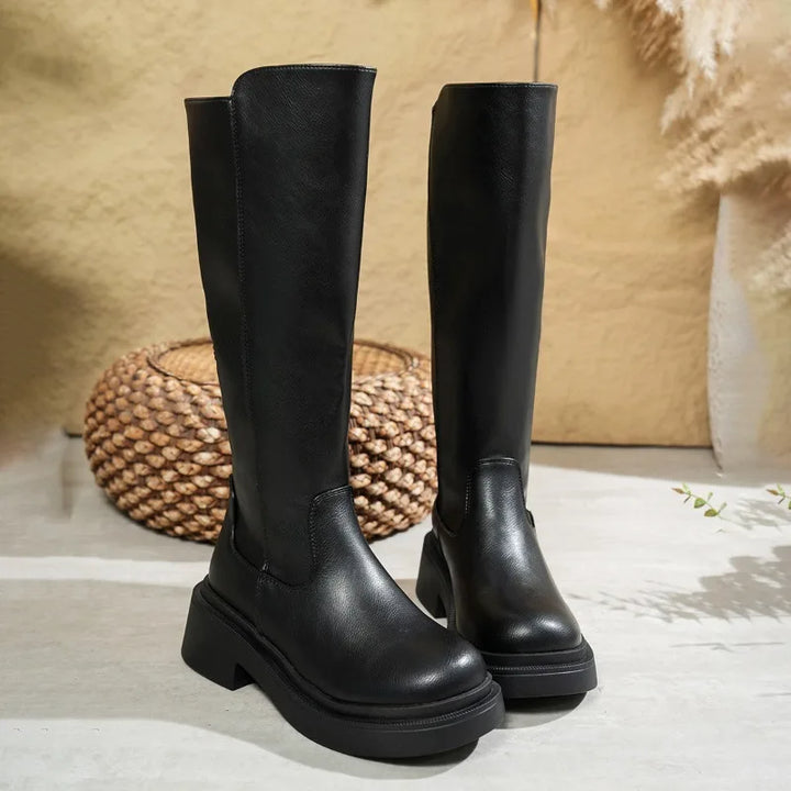 Versatile women's brown leather knee-high boots featuring a comfortable block heel for winter.