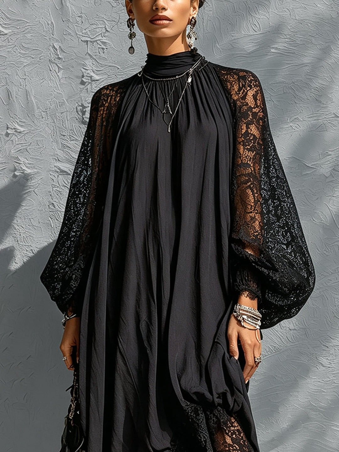 Chic women's black maxi dress with romantic lace balloon sleeves and a stylish high neck, ideal for elegant evening wear.