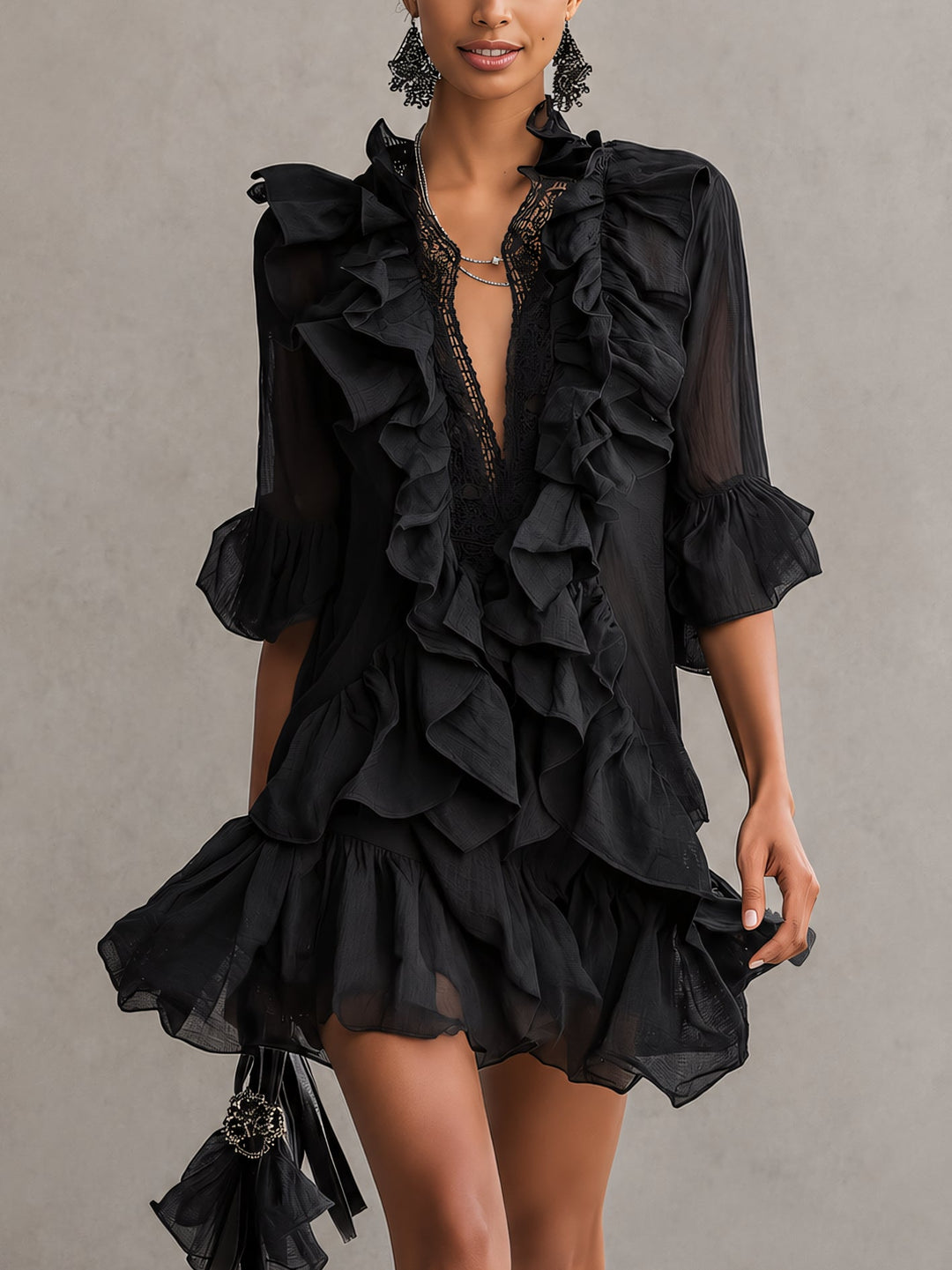 Elegant black ruffle mini dress for women with V-neck and sheer long sleeves, perfect for party & evening wear.