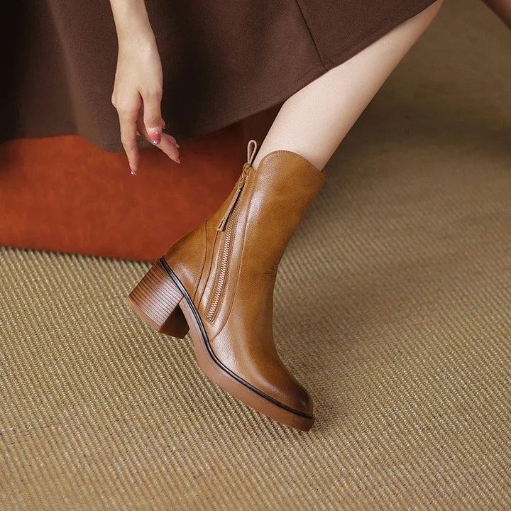 Stylish women's brown zipper boots with a fashionable block heel, ideal for everyday elegant footwear.