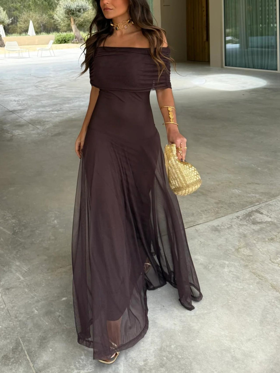 Elegant brown off-shoulder sheer overlay maxi dress, perfect for wedding guests & formal evening events.
