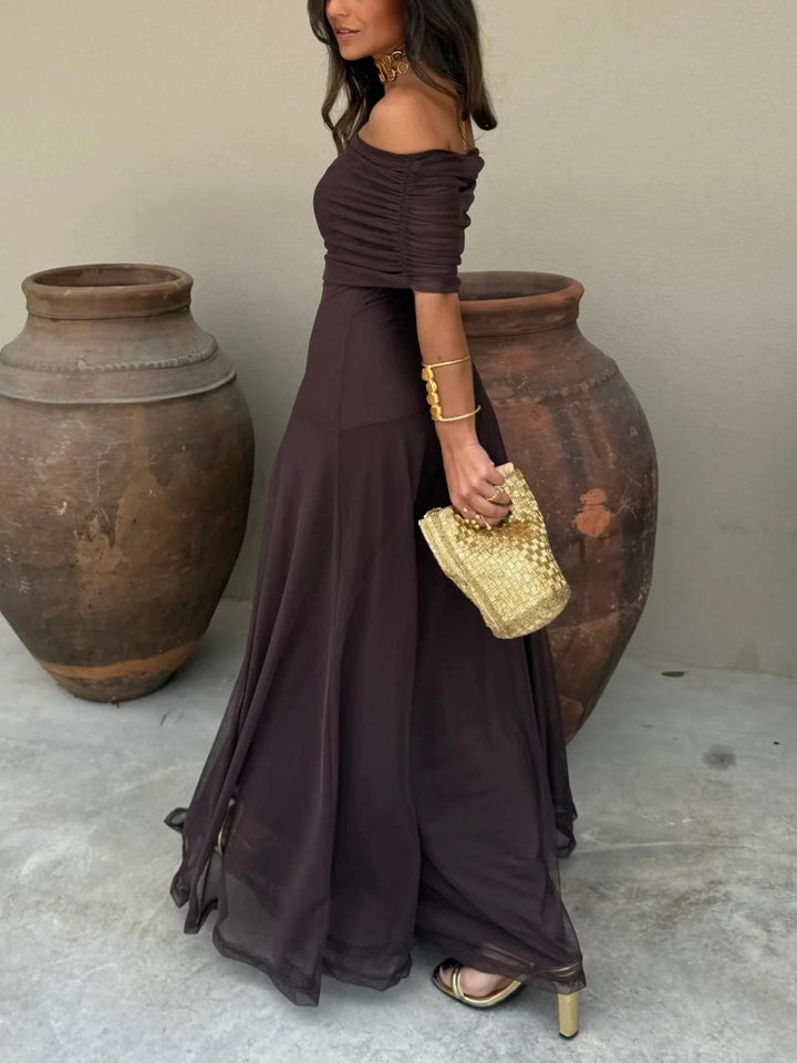 Women's elegant brown off-shoulder formal maxi dress with sheer overlay, ideal for special occasions.