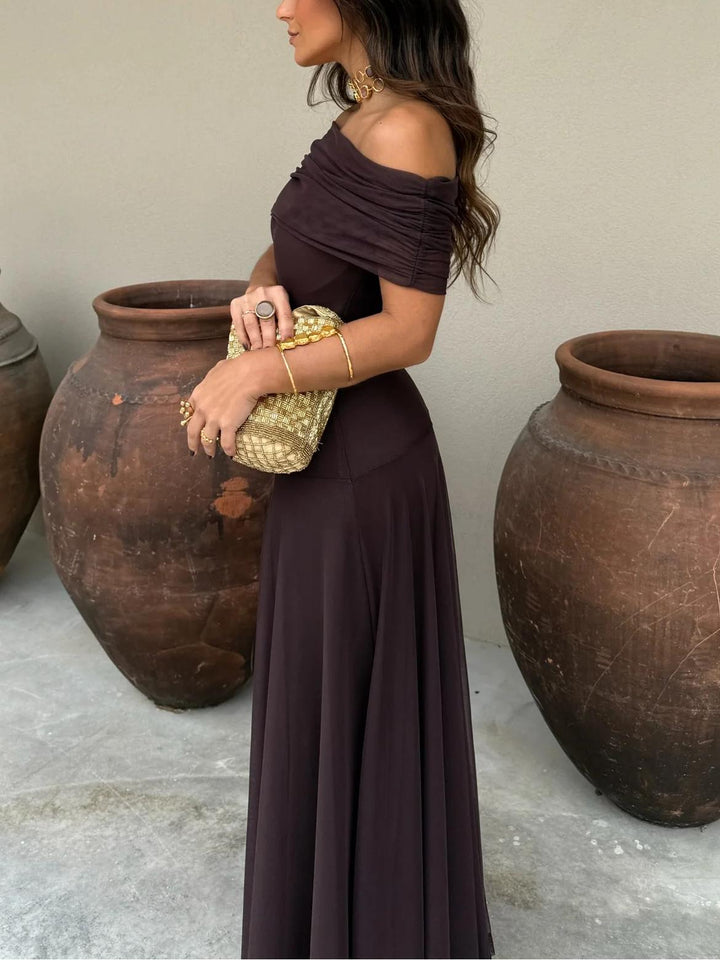 Chic brown off-shoulder sheer maxi dress for wedding guests, offering sophisticated style & comfort.