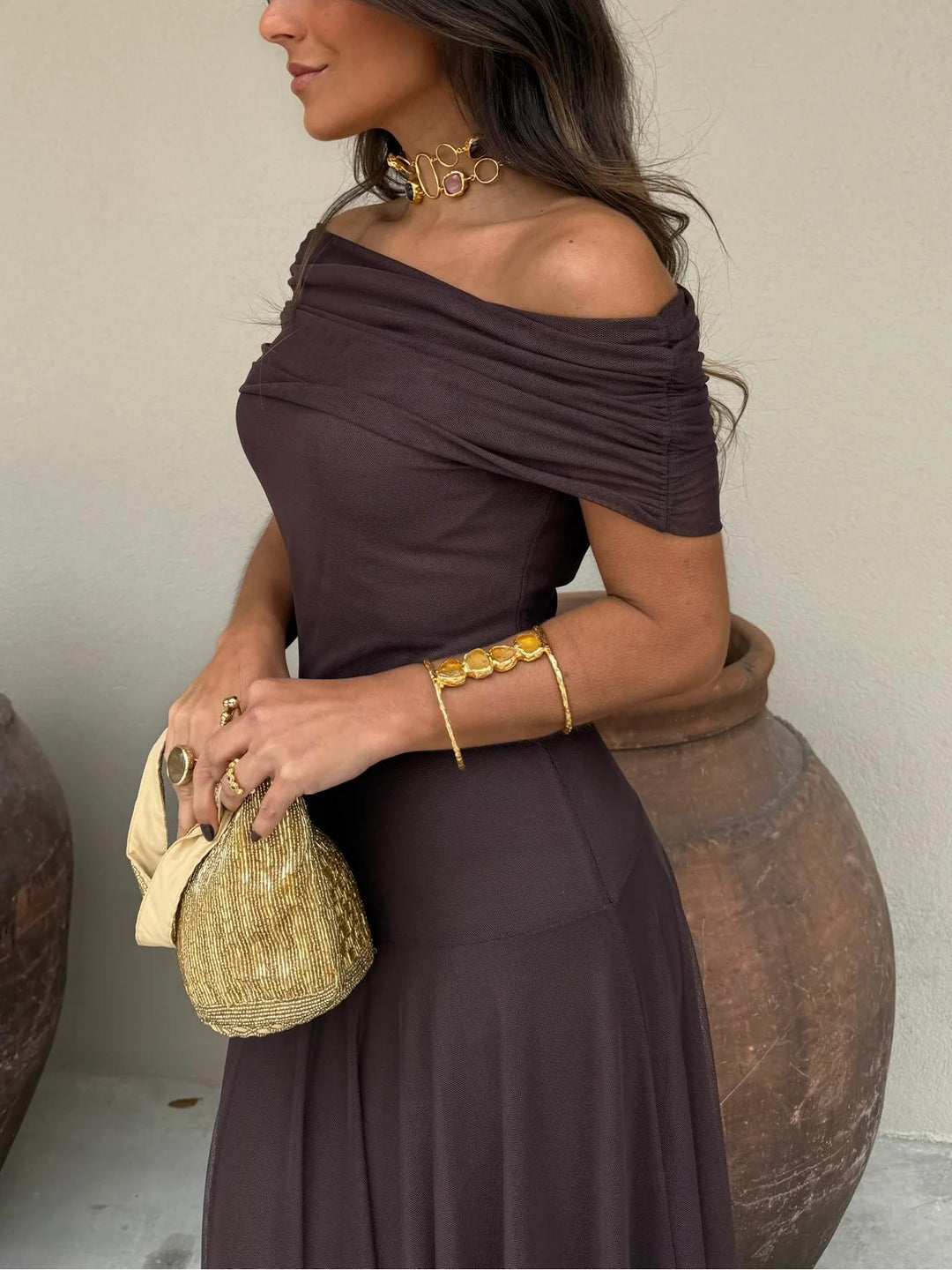 Versatile brown off-shoulder maxi dress with sheer overlay, an elegant choice for any formal event.