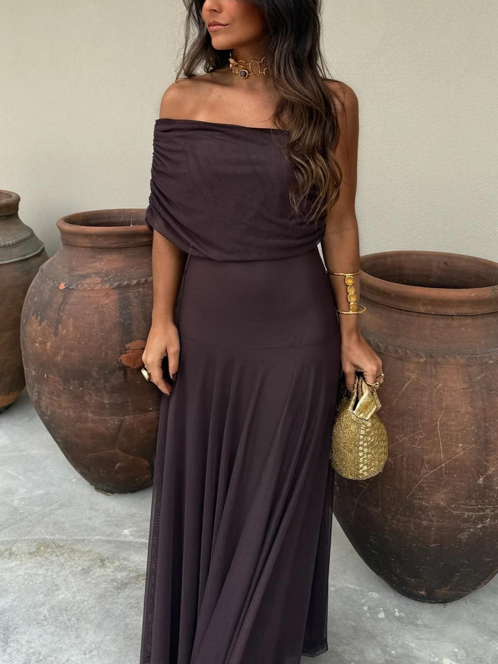Luxurious brown off-shoulder sheer overlay maxi wedding guest dress, a stunning & sophisticated look.
