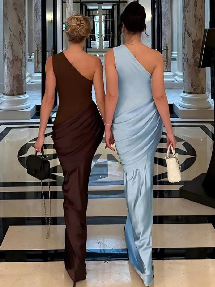 Elegant blue one-shoulder maxi dress featuring an asymmetrical neckline. Perfect women's formal wear for wedding guests & parties.