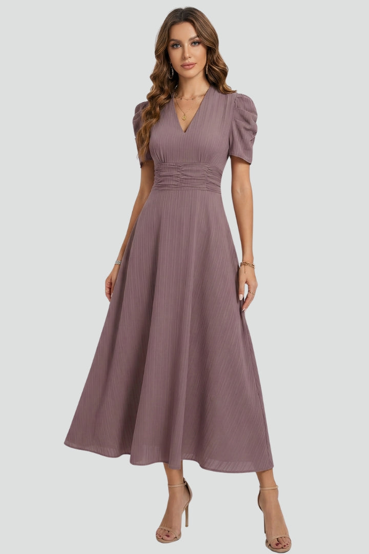 Women's stylish red V-neck midi dress featuring short sleeves, a flattering ruched waist, and a chic flared skirt.