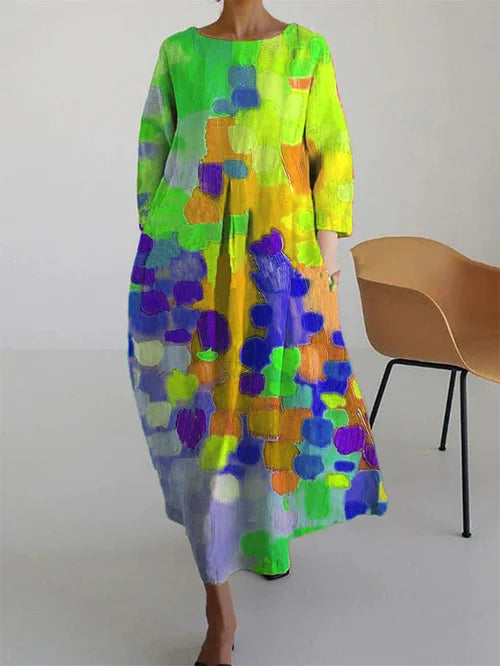 Casual women's maxi dress with long sleeves, vibrant color block pattern, offering a comfortable relaxed fit.