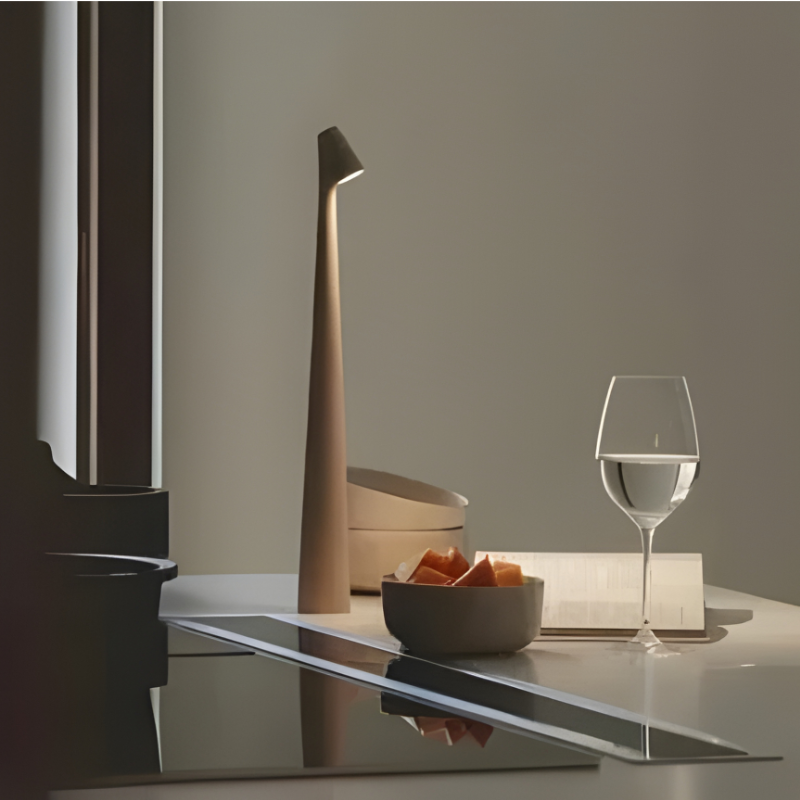 Modern dimmable LED table lamp, cordless for ambient mood lighting in home or office.
