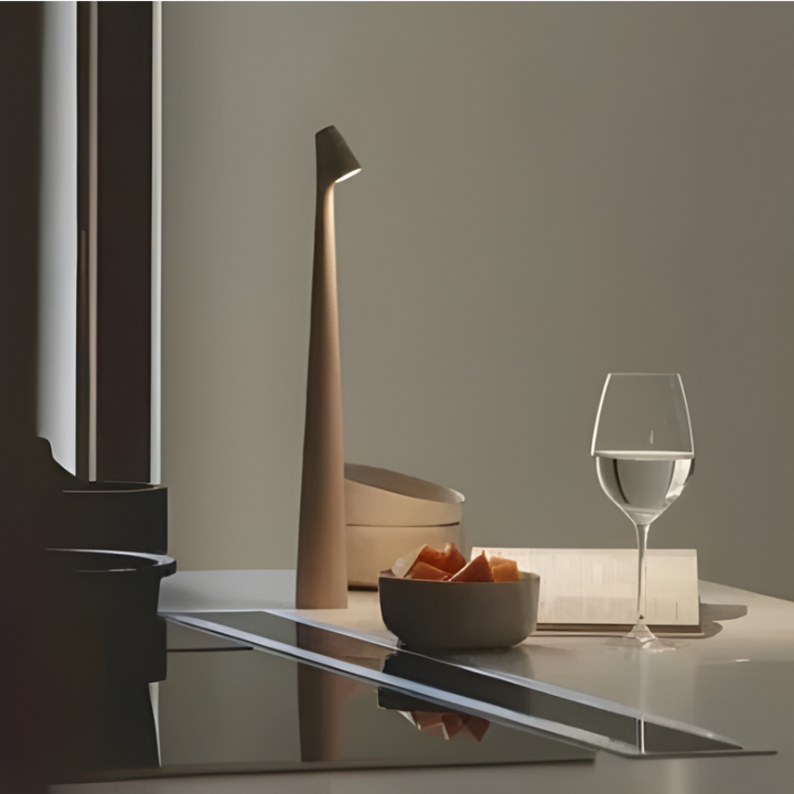 Modern dimmable LED table lamp, cordless for ambient mood lighting in home or office.