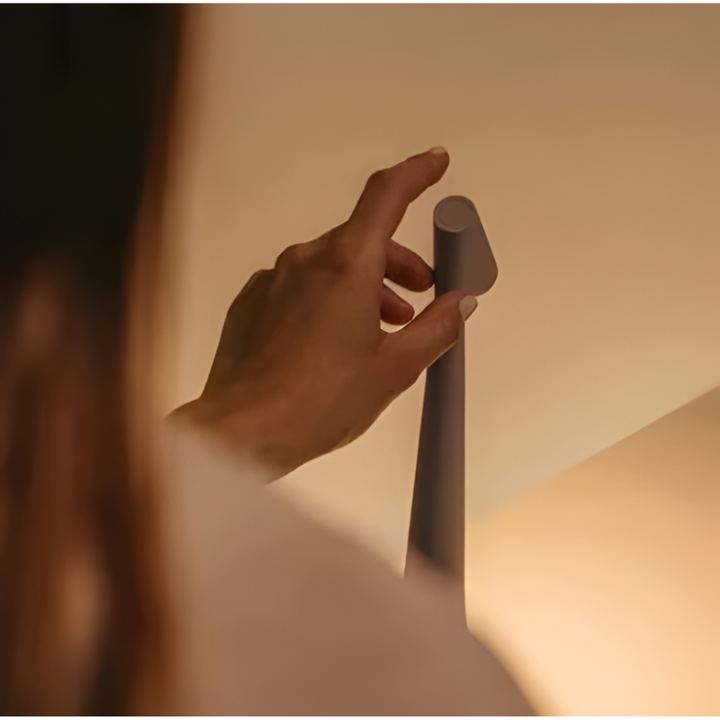 Sleek LED mood lamp with touch control, dimmable and cordless for versatile ambient lighting.