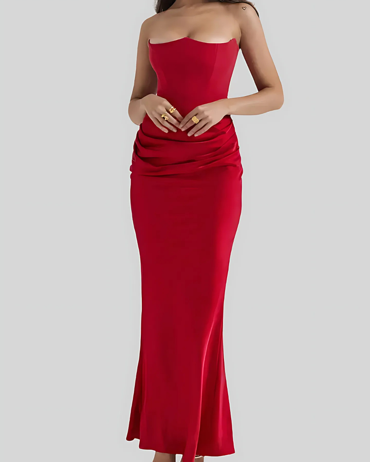 Luxurious draped maxi dress, perfect for a wedding guest, embodying formal sophistication.