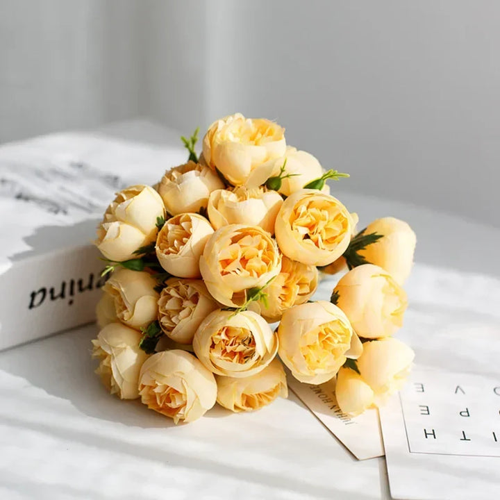 Rose colored silk peony bouquet. Elegant artificial flowers for a warm wedding or inviting home decor.