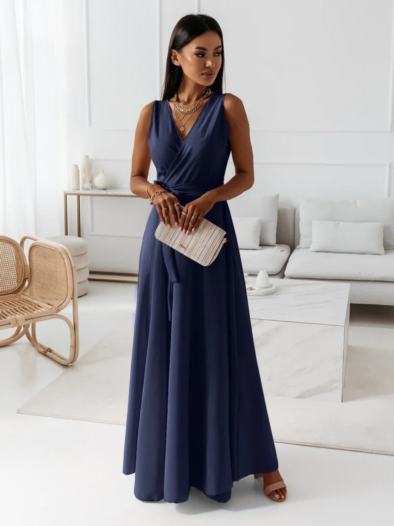 Close-up of the delicate fabric and draping of a women's elegant faux wrap maxi dress.
