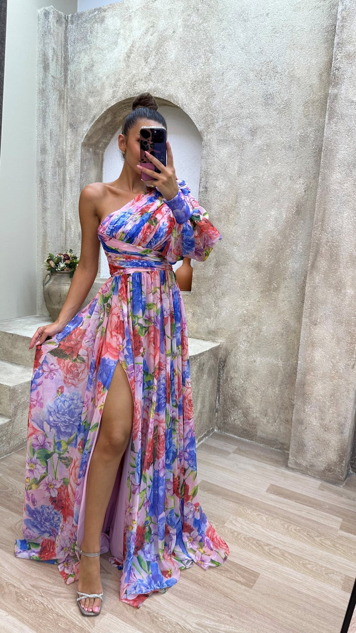 Elegant women's floral patterned maxi dress with a sophisticated slit, ideal for versatile styling
