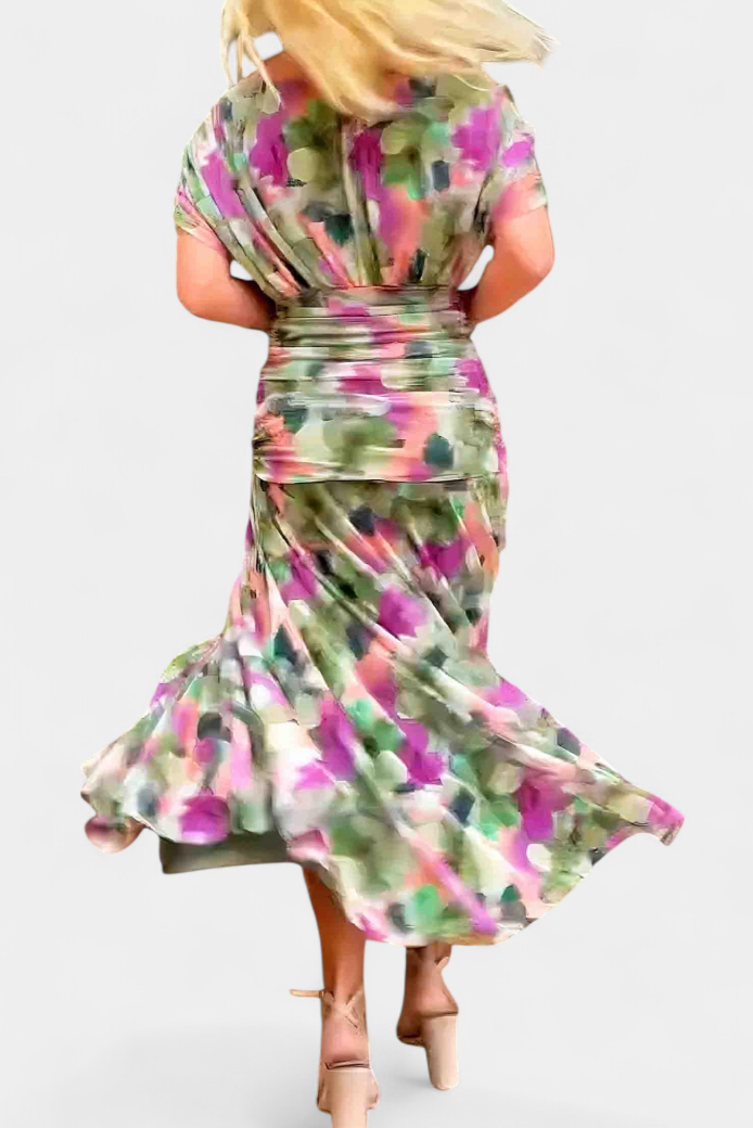 Soft flowing women's elegant floral maxi dress, V-neck, with a distinct and flattering pleated waist.