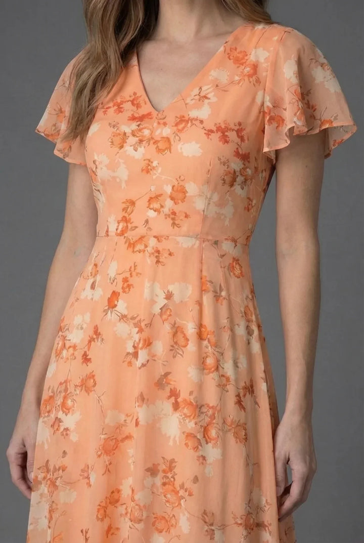 Women's V-neck floral maxi dress with delicate flutter sleeves, perfect for elegant evening or spring occasions.