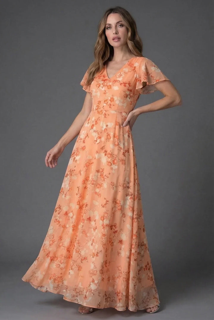 Beautiful floral print maxi dress for women featuring a V-neck and flowing flutter sleeves. Summer elegant wear.