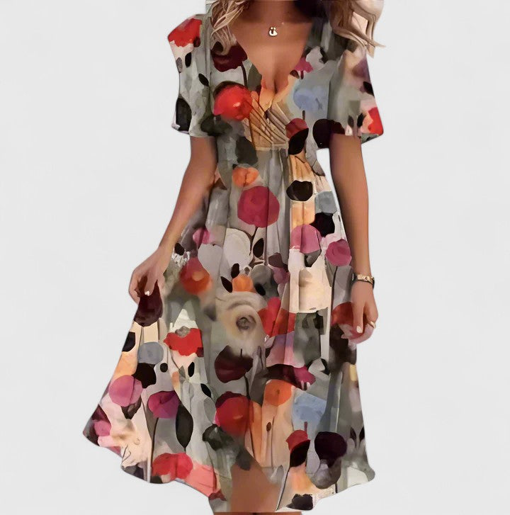 Flattering women's elegant floral short dress with V-neck, high-low hem, and delicate flutter sleeves.