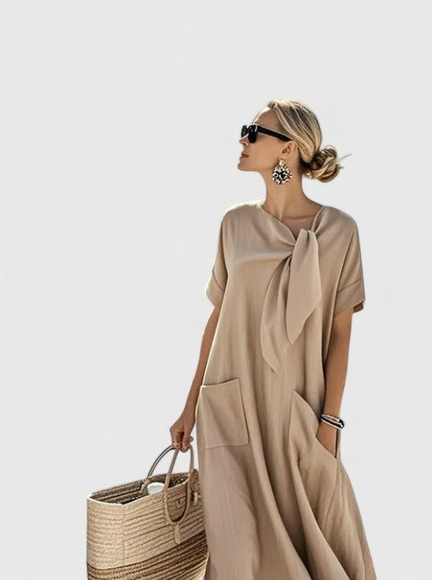 Women's elegant summer dress, featuring a graceful flowing silhouette, perfect for effortless chic.