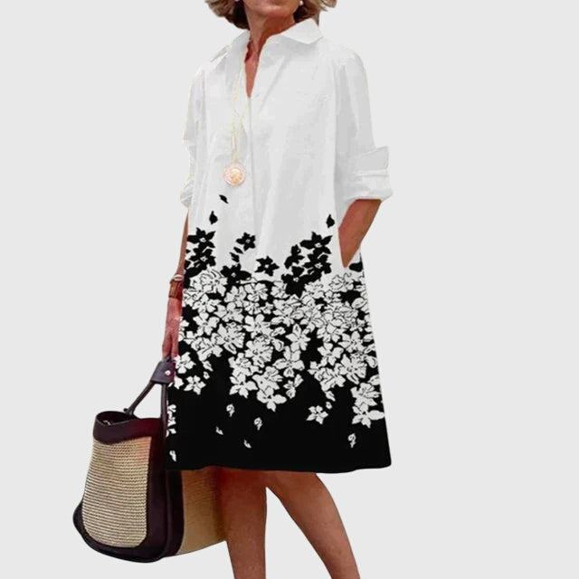 Woman enjoying a beautiful day in an elegant flowy dress with pockets. Comfortable, versatile summer fashion.