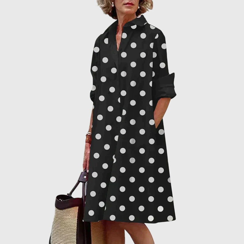 Woman twirling, showing the graceful flow of an elegant dress with pockets. Ideal comfortable summer fashion.