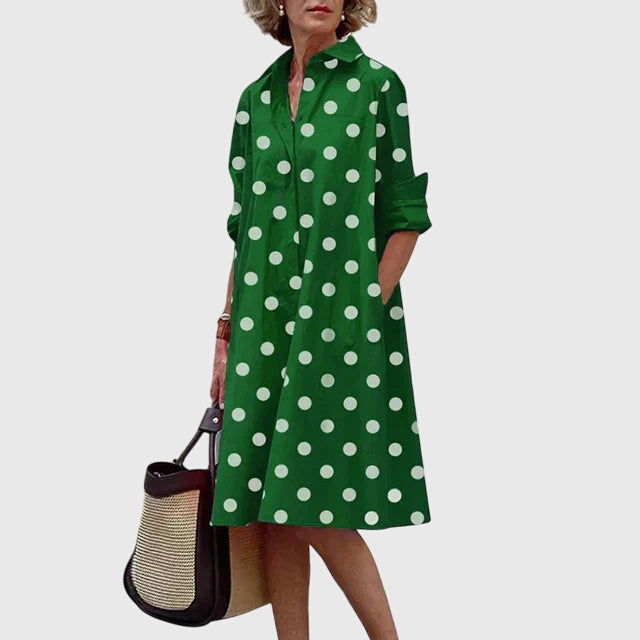 Vibrant elegant flowy women's dress with practical pockets. Comfortable and stylish for summer casual wear.