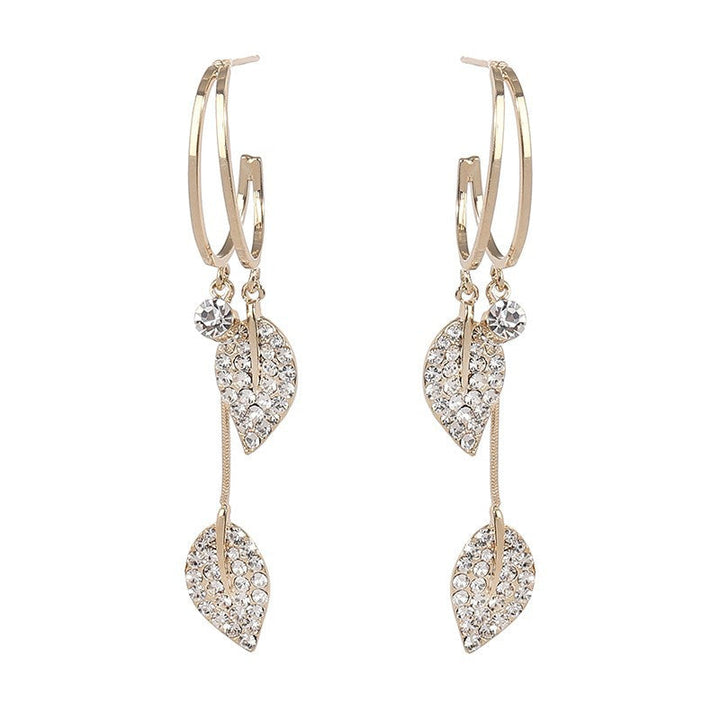 Chic gold leaf dangle earrings for women, expressing a blend of sea and fashion