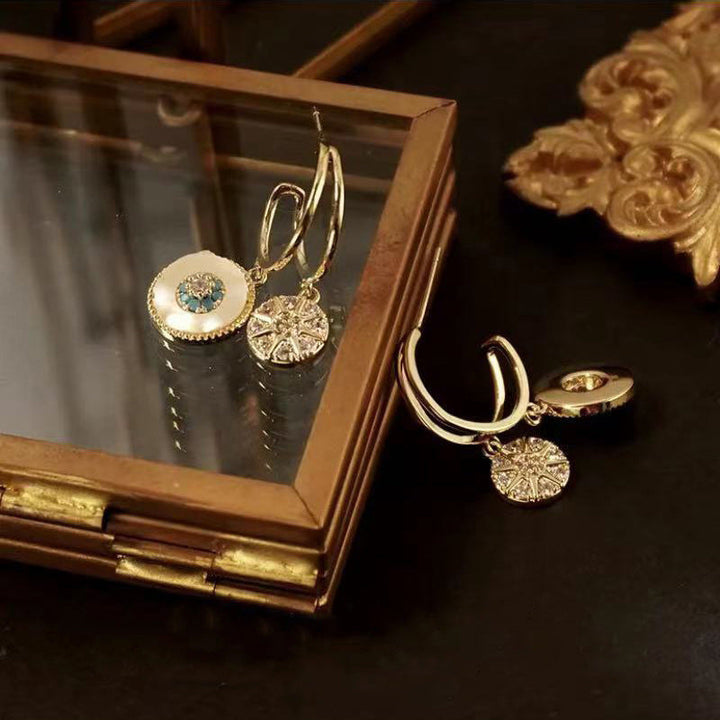 Beautiful gold leaf dangle drop earrings, capturing the essence of sea-inspired jewelry