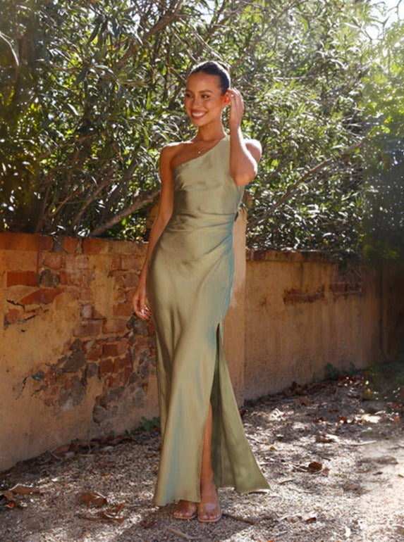 Women's flowy one-shoulder maxi dress in a vibrant green, suitable for casual or formal wear