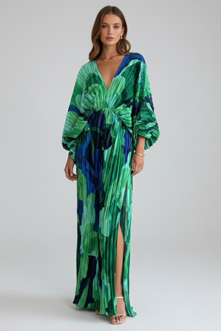 Women's flowy green printed maxi dress with a sophisticated V-neck and elegant pleats, long sleeves.