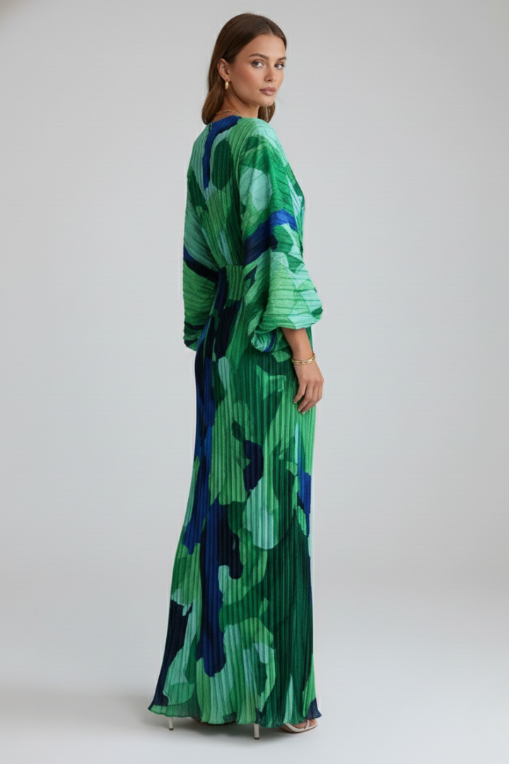 Printed green maxi dress for women. Elegant V-neck, pleated skirt, and long sleeves suitable for occasions.