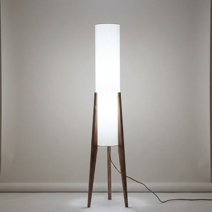 Cozy living room illuminated by a modern LED floor lamp. Scandinavian style, warm ambient light, walnut finish.