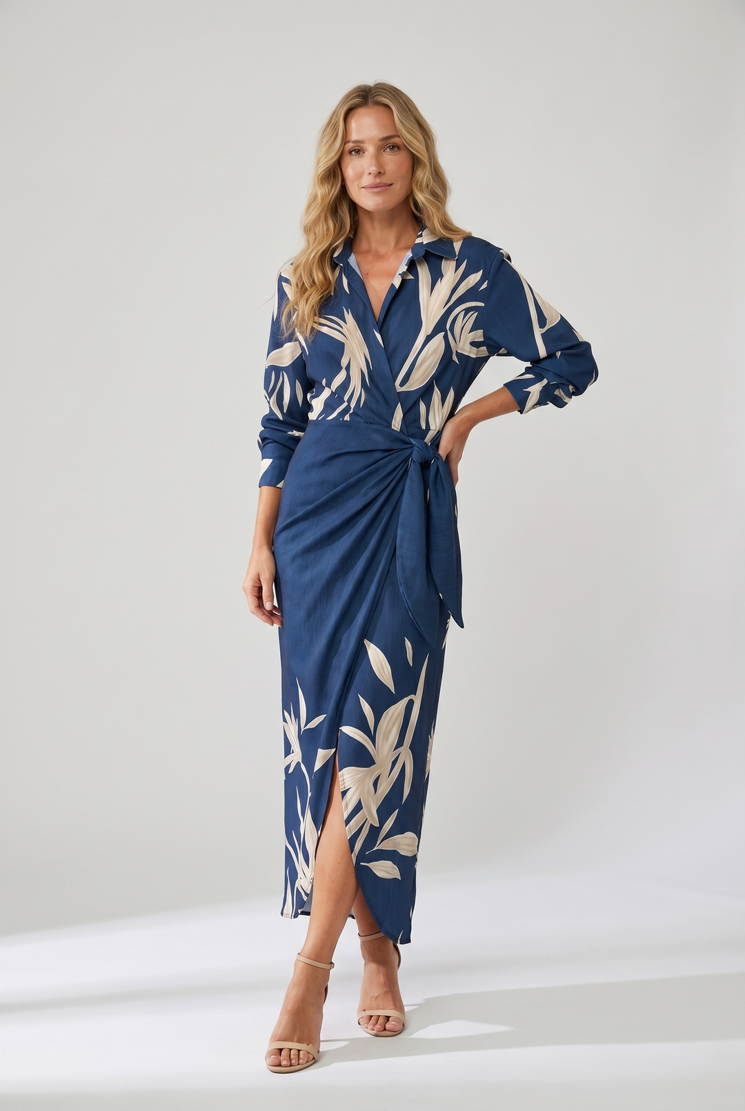 Women's flowy long sleeve V-neck maxi dress, featuring elegant leaf print and side slit.