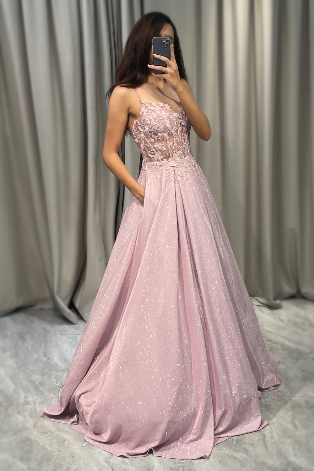 Full-length light pink embellished dress for women, a sophisticated choice for a wedding guest outfit.