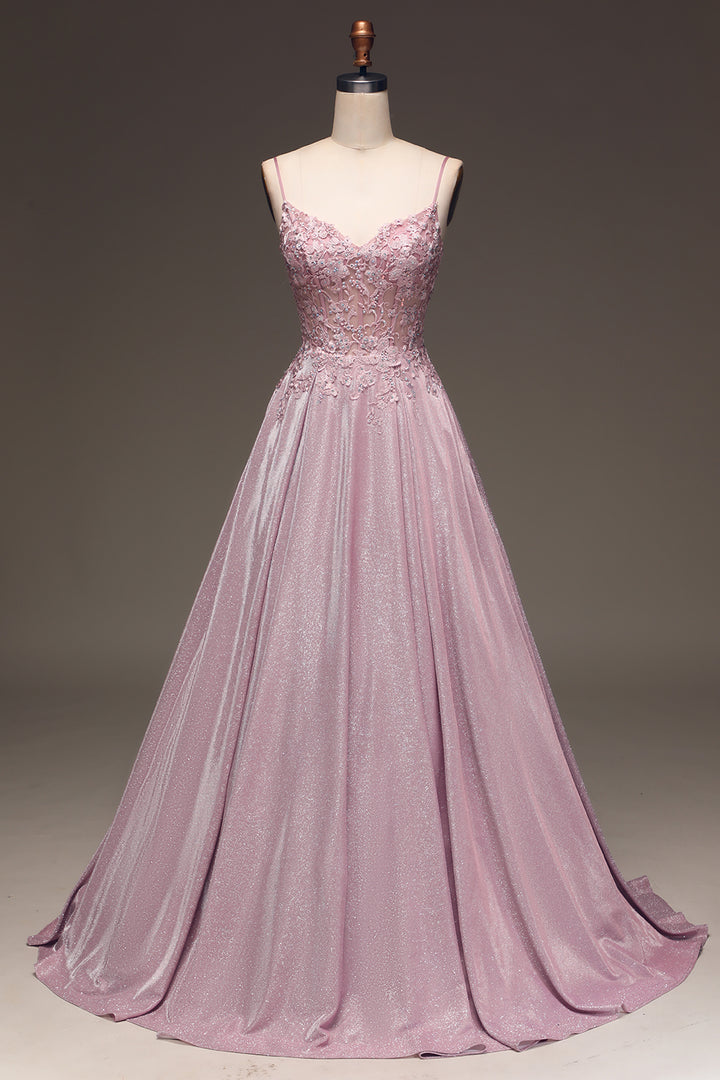 Stylish women's maxi dress in light pink with elegant embellishments, suitable for formal event wear.