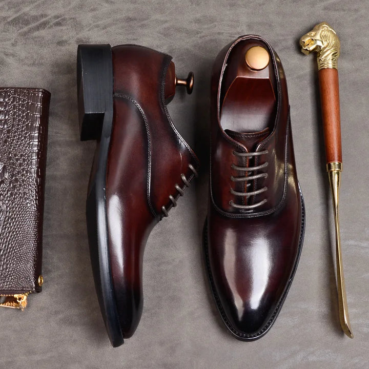 Stylish men's lace-up Oxford dress shoes with a sleek design, suitable for formal, business, or wedding events. Comfortable footwear.