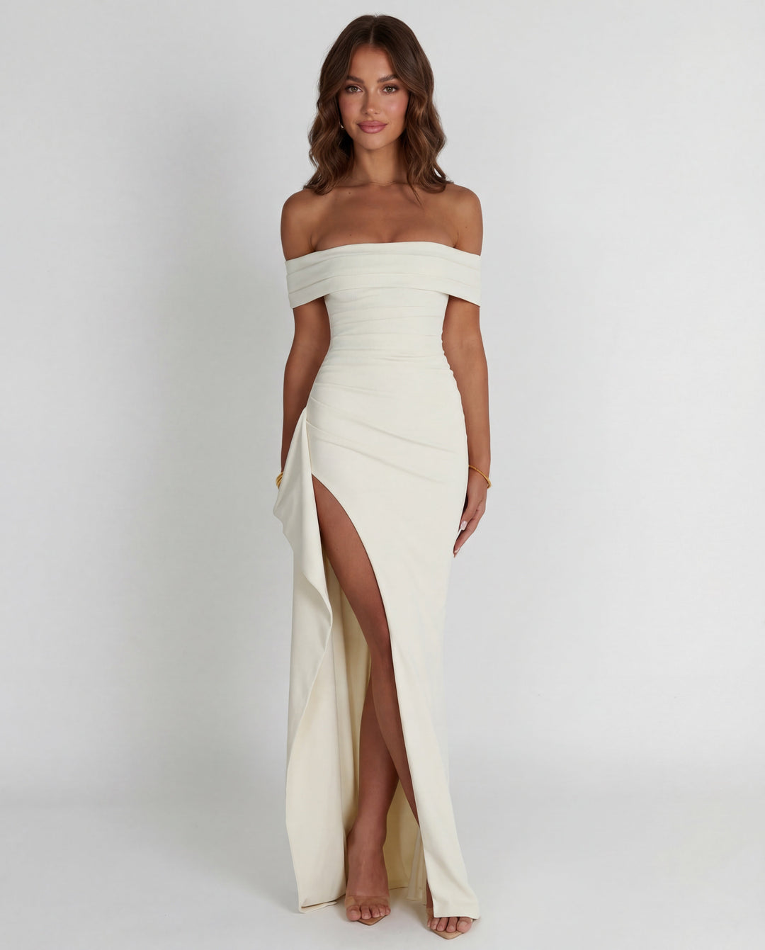 Close-up of elegant off-shoulder neckline & flattering ruched details on a women's bodycon maxi dress.