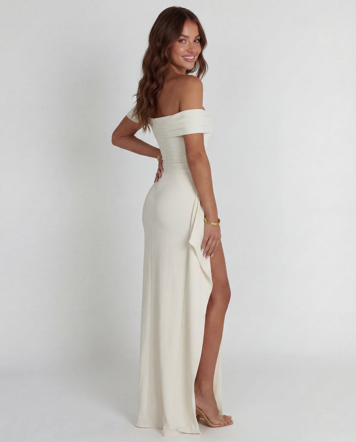 Sleek bodycon silhouette of a women's off-shoulder ruched maxi dress, ideal for parties & evening.
