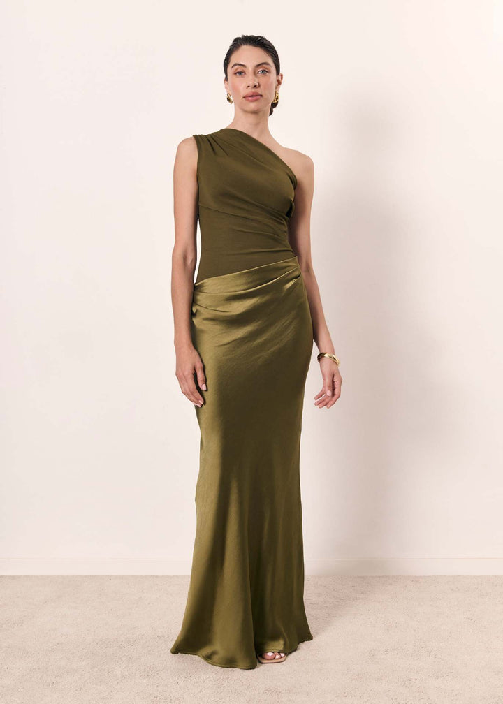 Close-up of the delicate fabric and single shoulder strap of an elegant women's evening dress