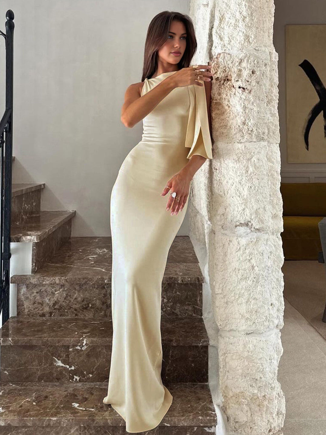 Women's summer fashion one-shoulder long dress in off-white, ideal for elegant party wear.