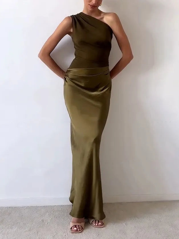 Flowing one-shoulder pleated maxi dress for women. Sophisticated formal wear & evening gown.